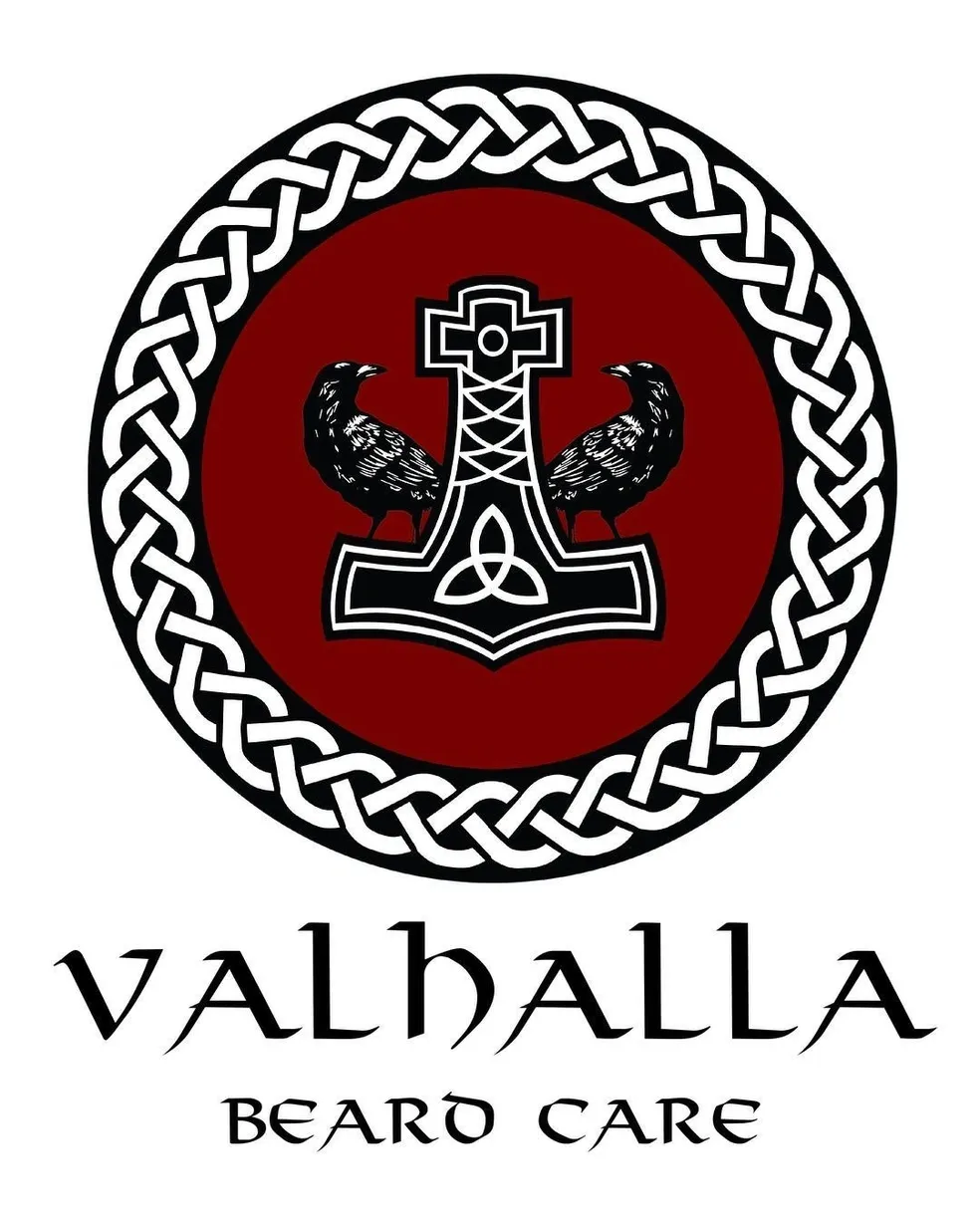A red and white logo with the name of valhalla.