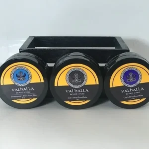 Three different flavors of valhalla shave soap in a black holder.
