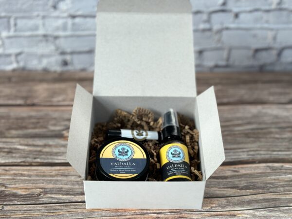 A box of beard oil and balm sitting on top of a table.