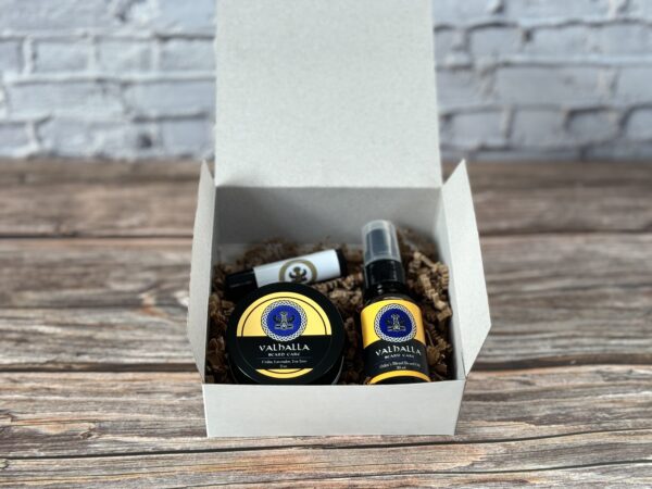 A box with two bottles of oil and a balm.