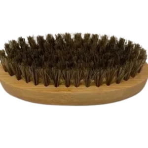 A brush with a wooden handle and a large amount of hair.
