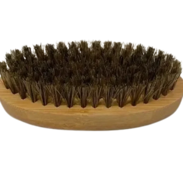 A brush with a wooden handle and a large amount of hair.