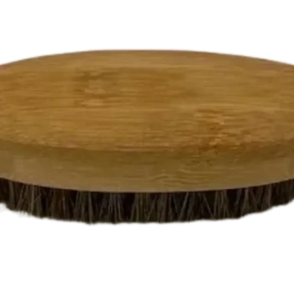 A wooden plate with some type of brush on top