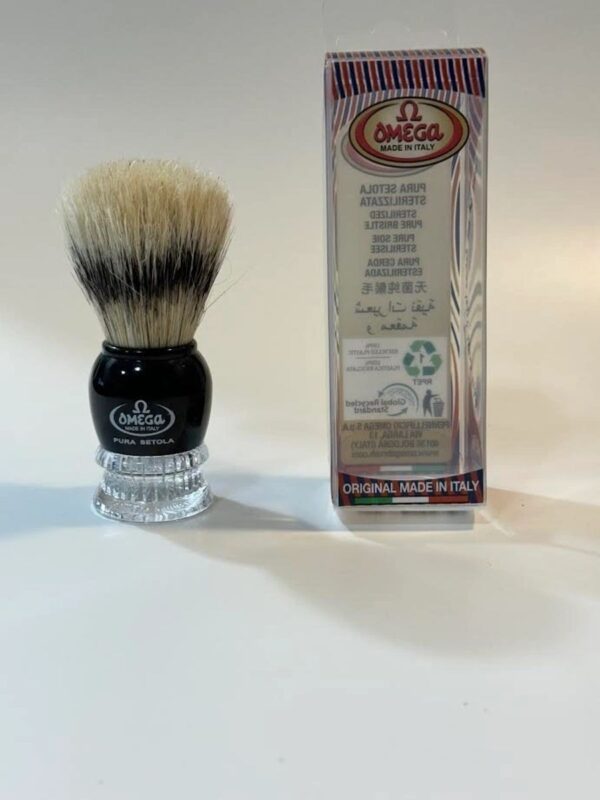 A shaving brush and its box on the table