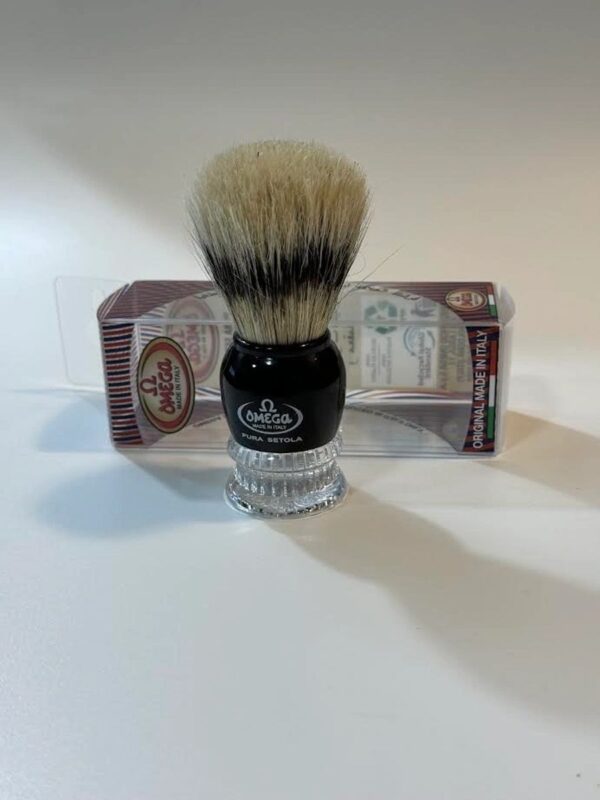 A shaving brush sitting on top of a counter.