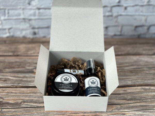 A box with a bottle of beard oil and balm.