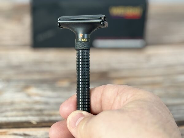 A person holding a razor in their hand.
